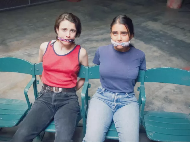 Margaret Qualley and Geraldine Viswanathan in Drive-Away Dolls