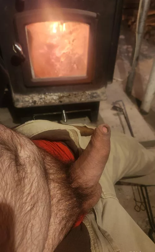 In front of the fire