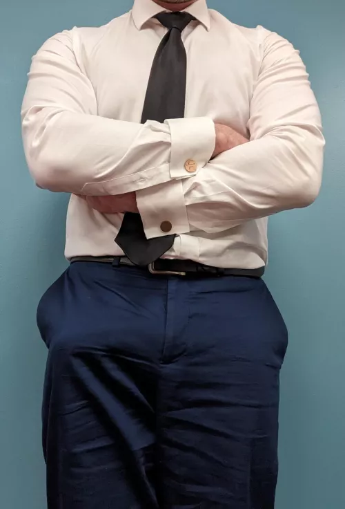 Strong forearms stretching my shirt. Huge cock bulging out in my suit pants.
