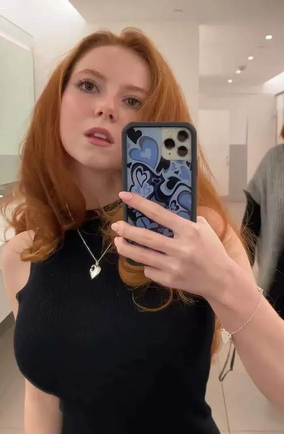 Busty redhead