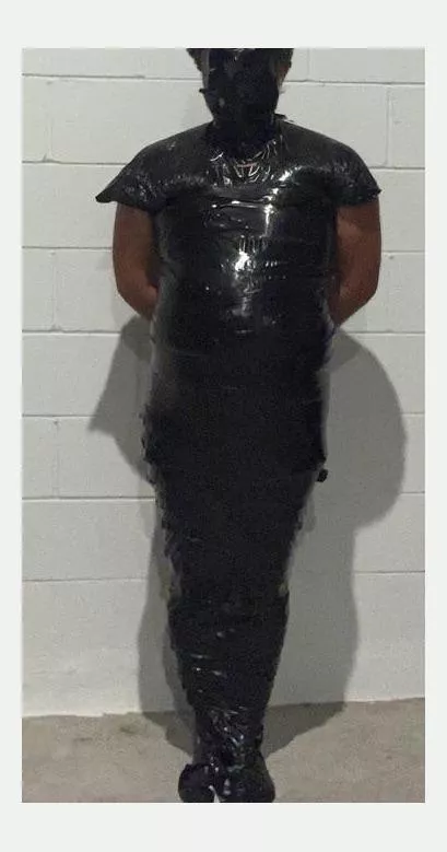 Mummified ln black tape