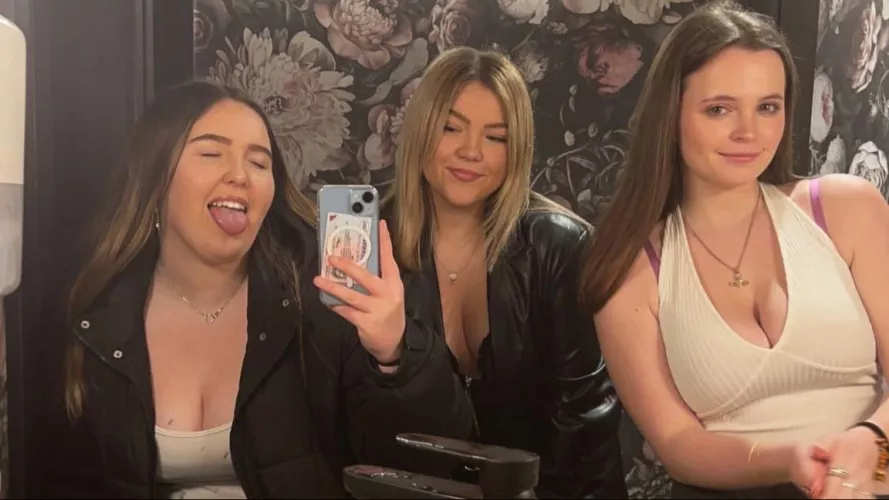 Three girls enter the girls toilets...