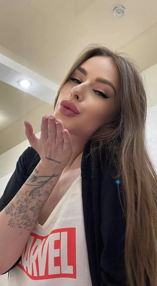 A bright candy girl gives affection with her tongue