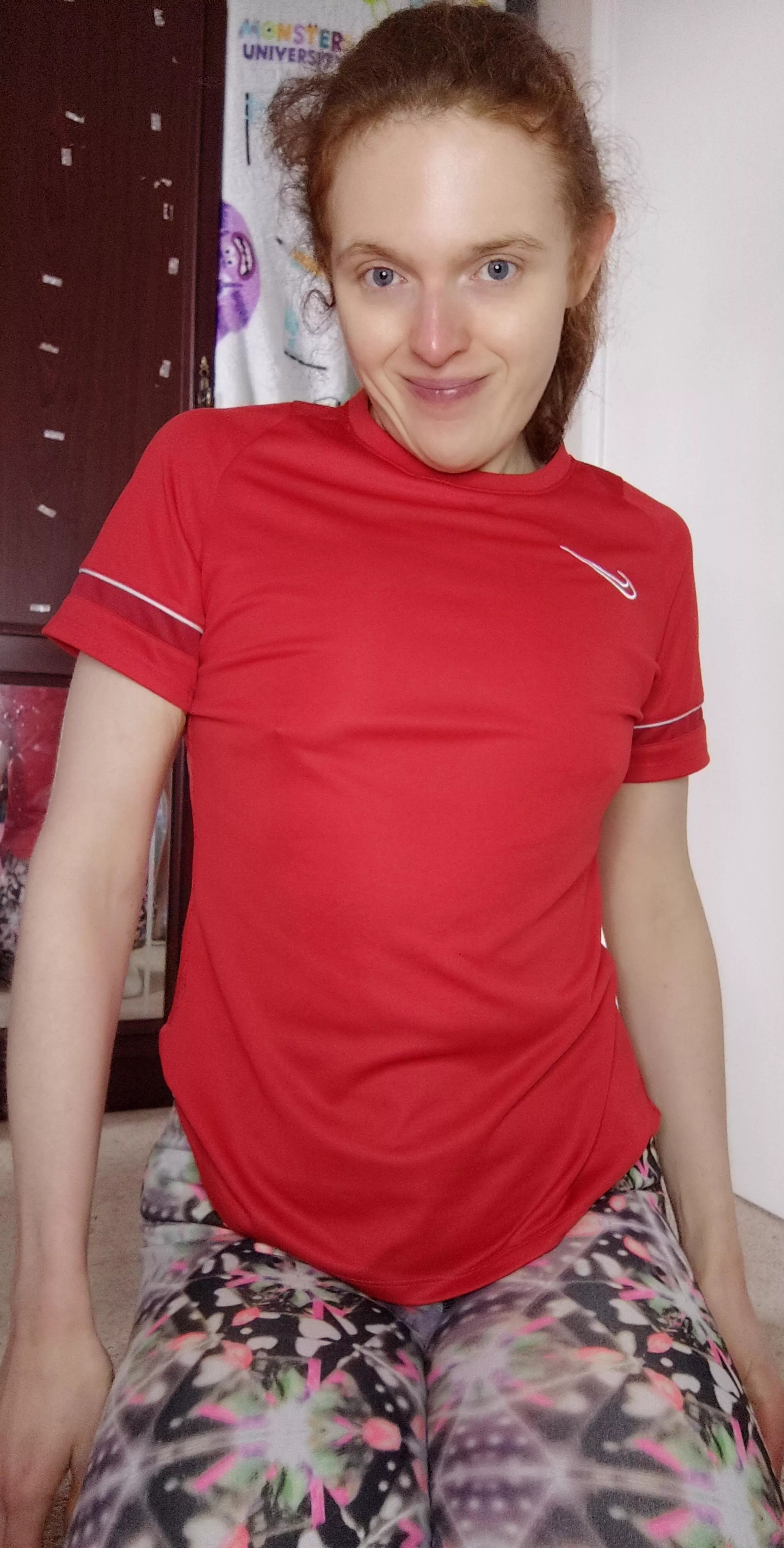 A redhead in a red gym shirt is sexy 