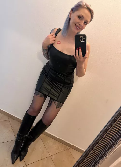 Can’t not smile wearing leather boots and mini dress 