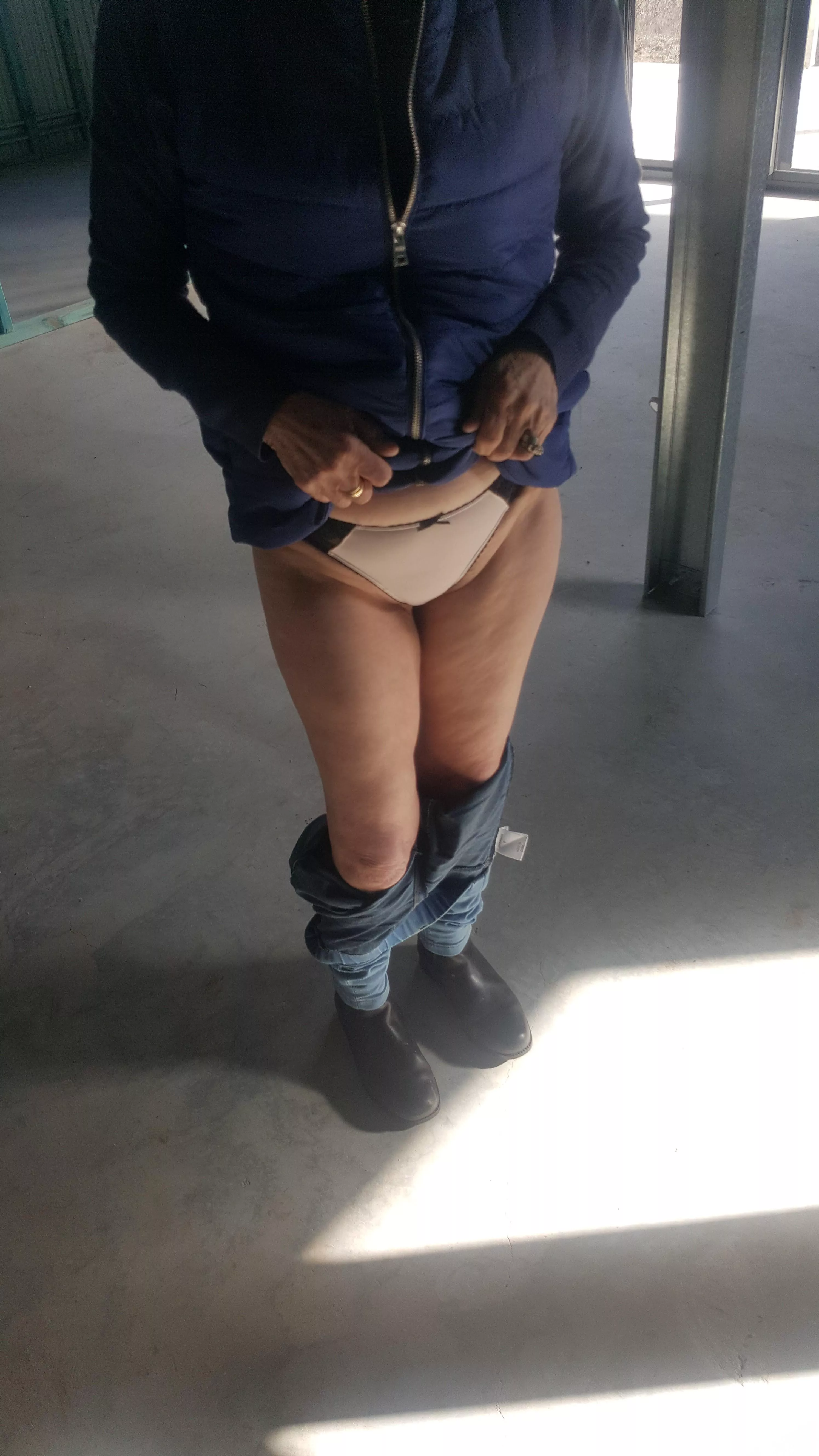 Queen being stripped off on a building site