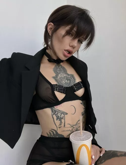 Serious woman loves Happy Meals and Coke