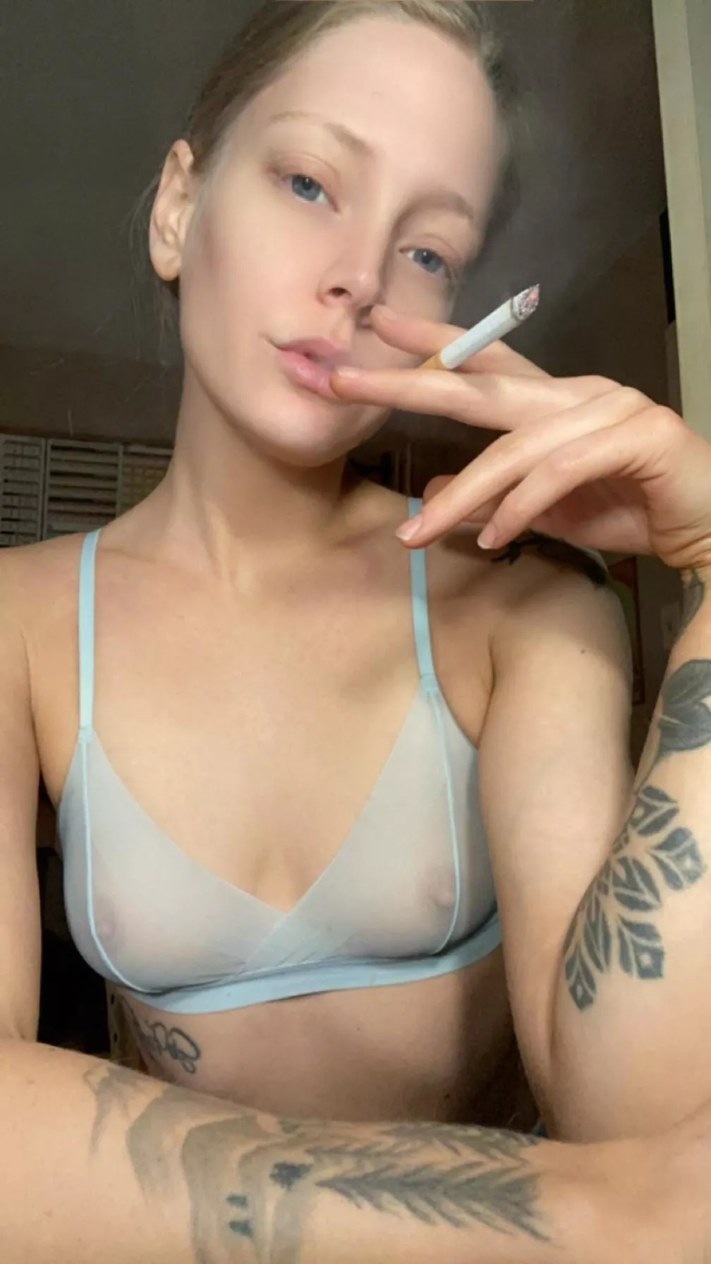 Freely smoking with my tits out 