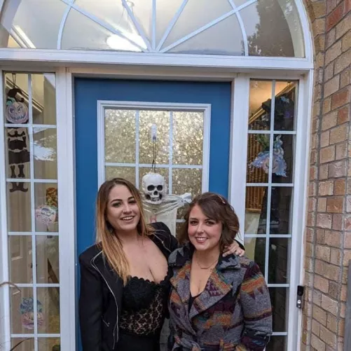 Her chubby friend kept her coat buttoned for a reason