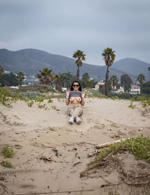 Here I am flashing my boobs on a public beach.