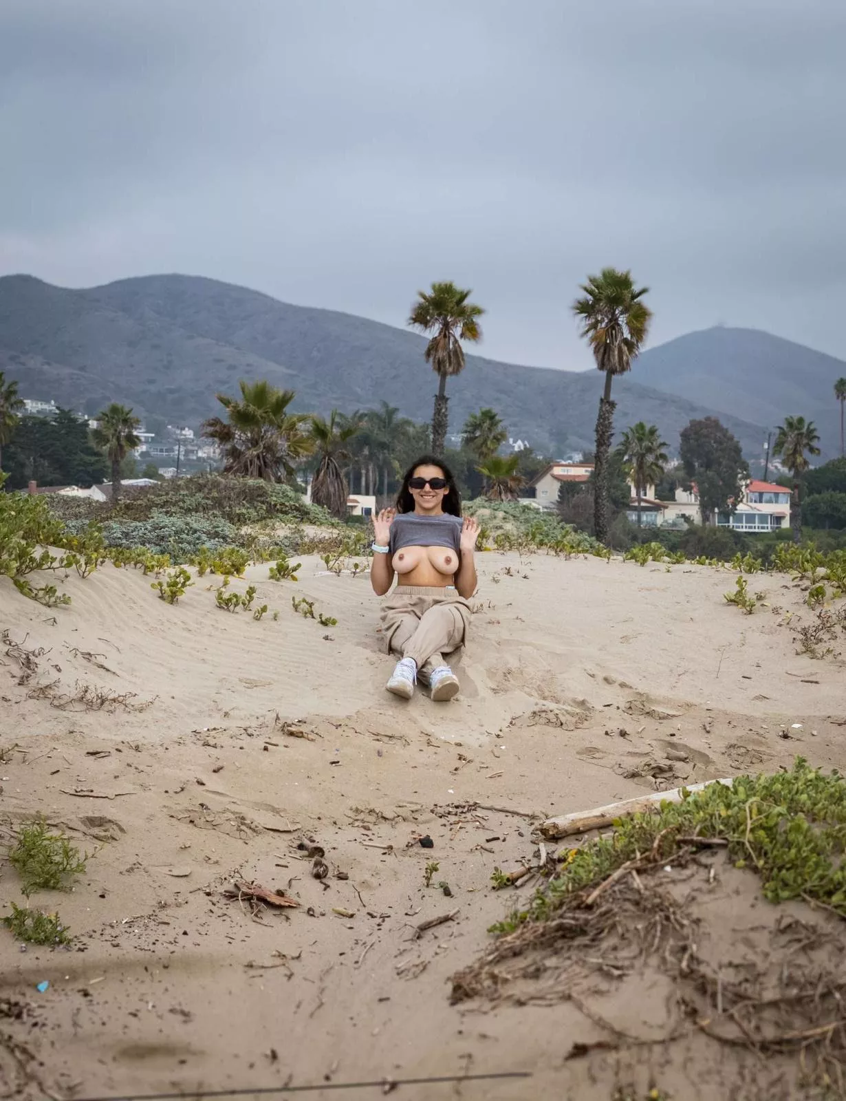 Here I am flashing my boobs on a public beach.