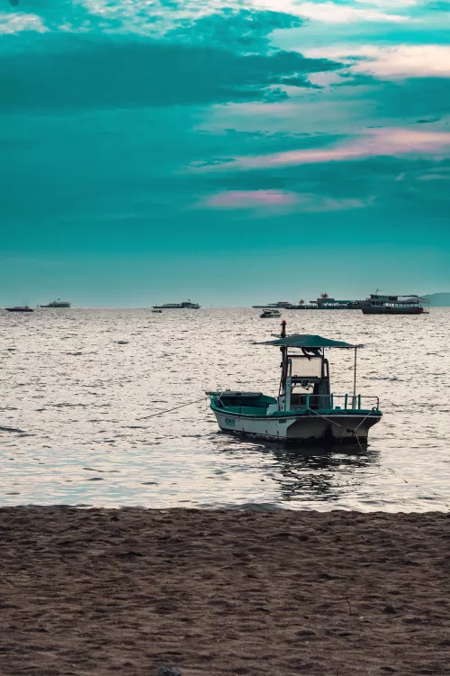 ITAP boat near beach at sunset