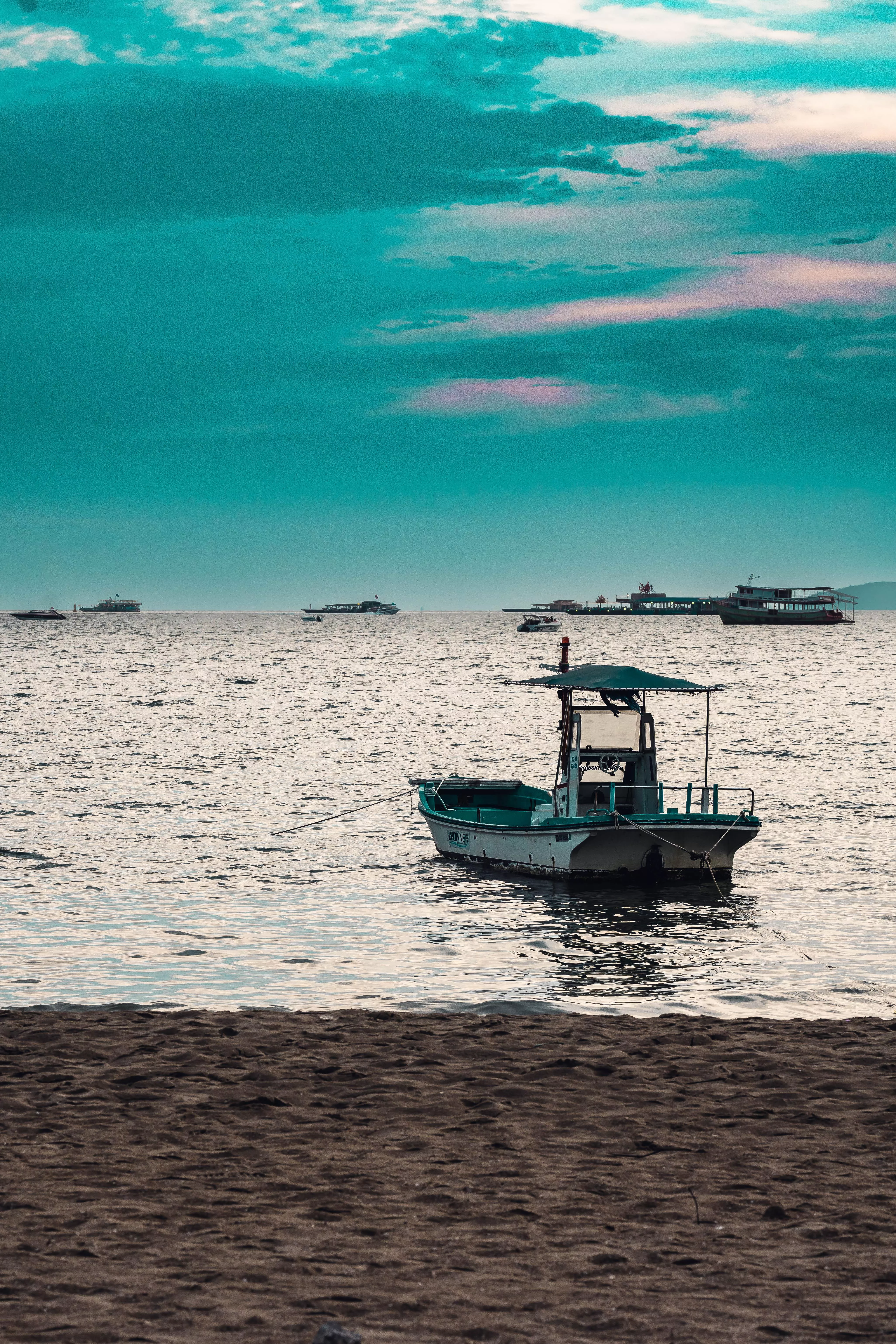 ITAP boat near beach at sunset