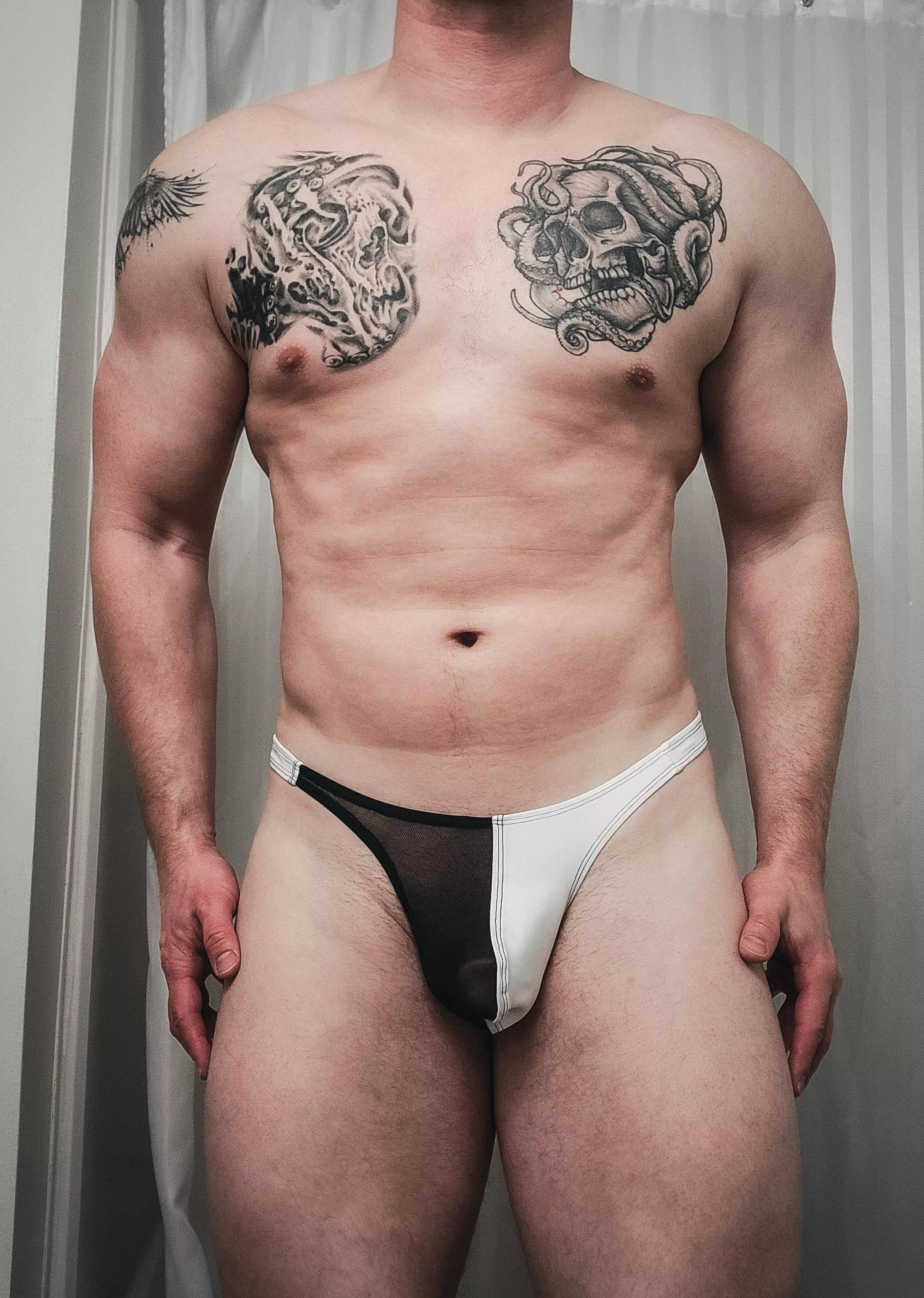 White with half black mesh pouch.