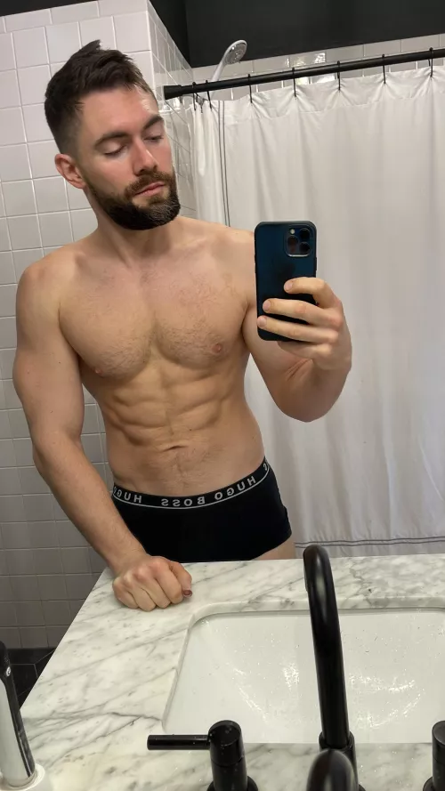 black Hugo Boss trunks against white marble