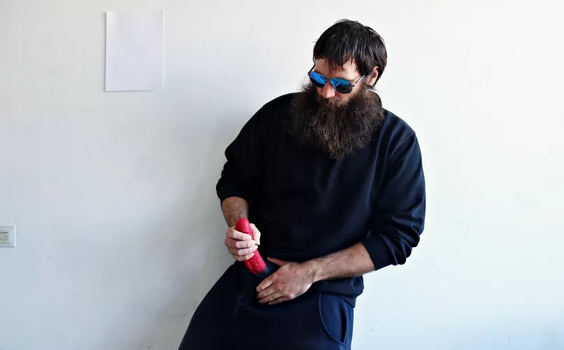 Me, with a large red dildo, while I am wearing sunglasses