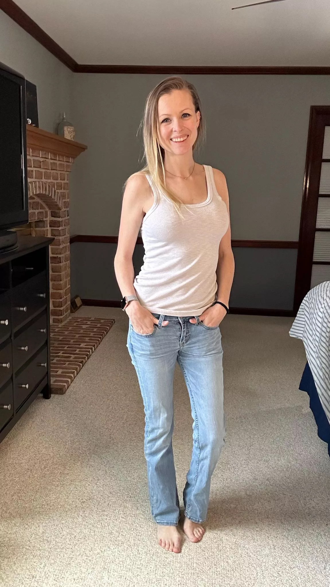 Who doesn’t love a busty MILF in a white tank and no bra