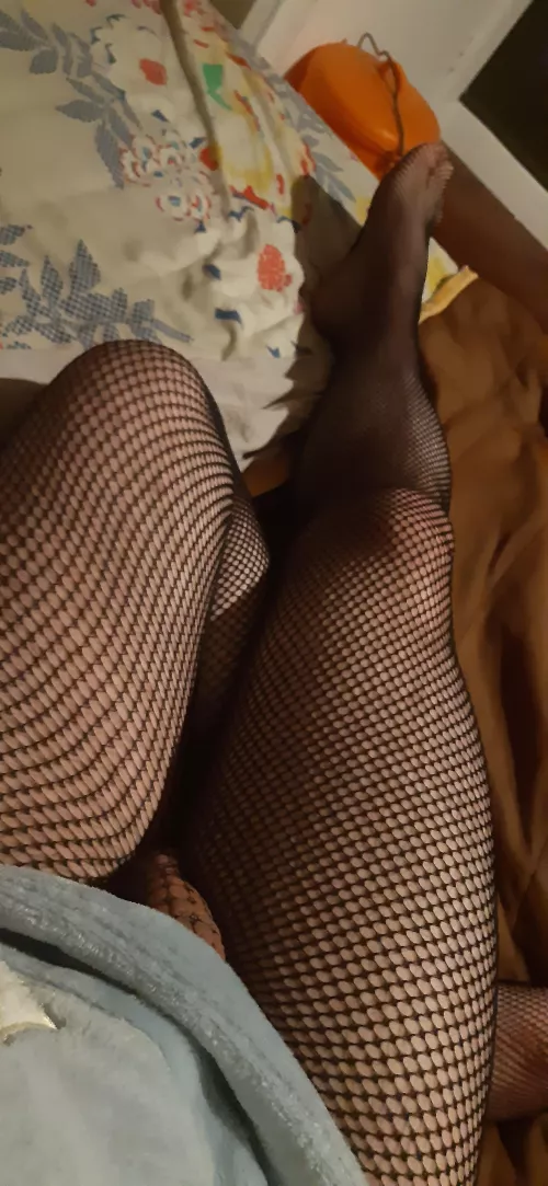 Comfy clothes and fishnet thighs