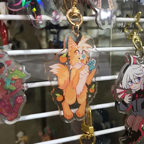 i got an acrylic charm of my fursona! 🍊