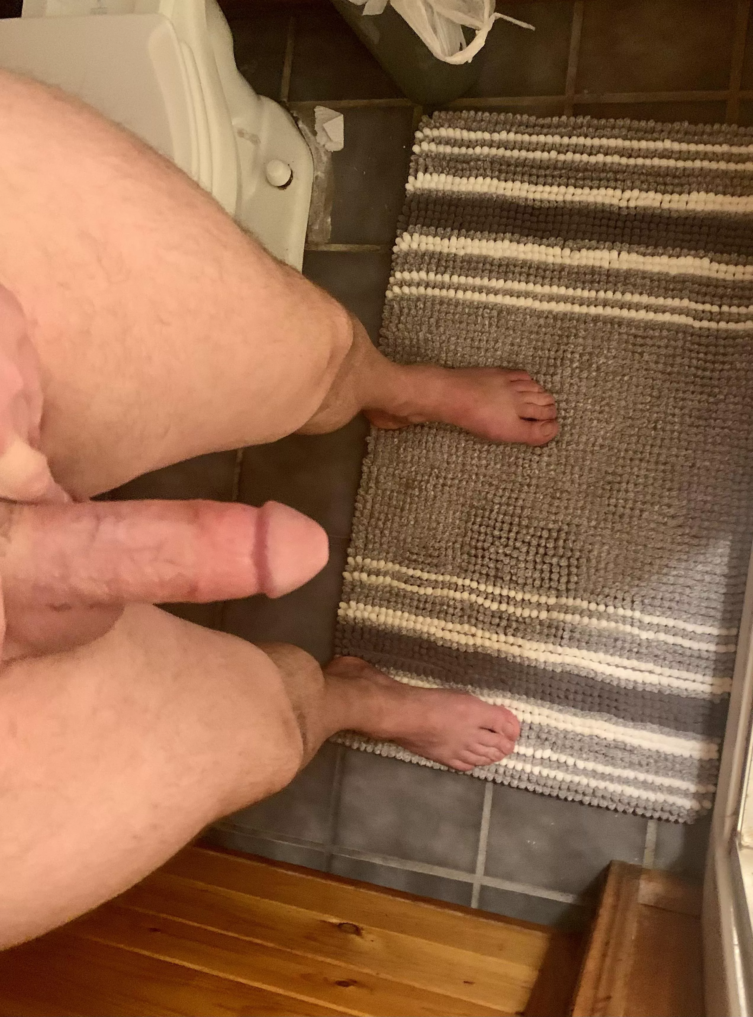 Stepping into the shower.