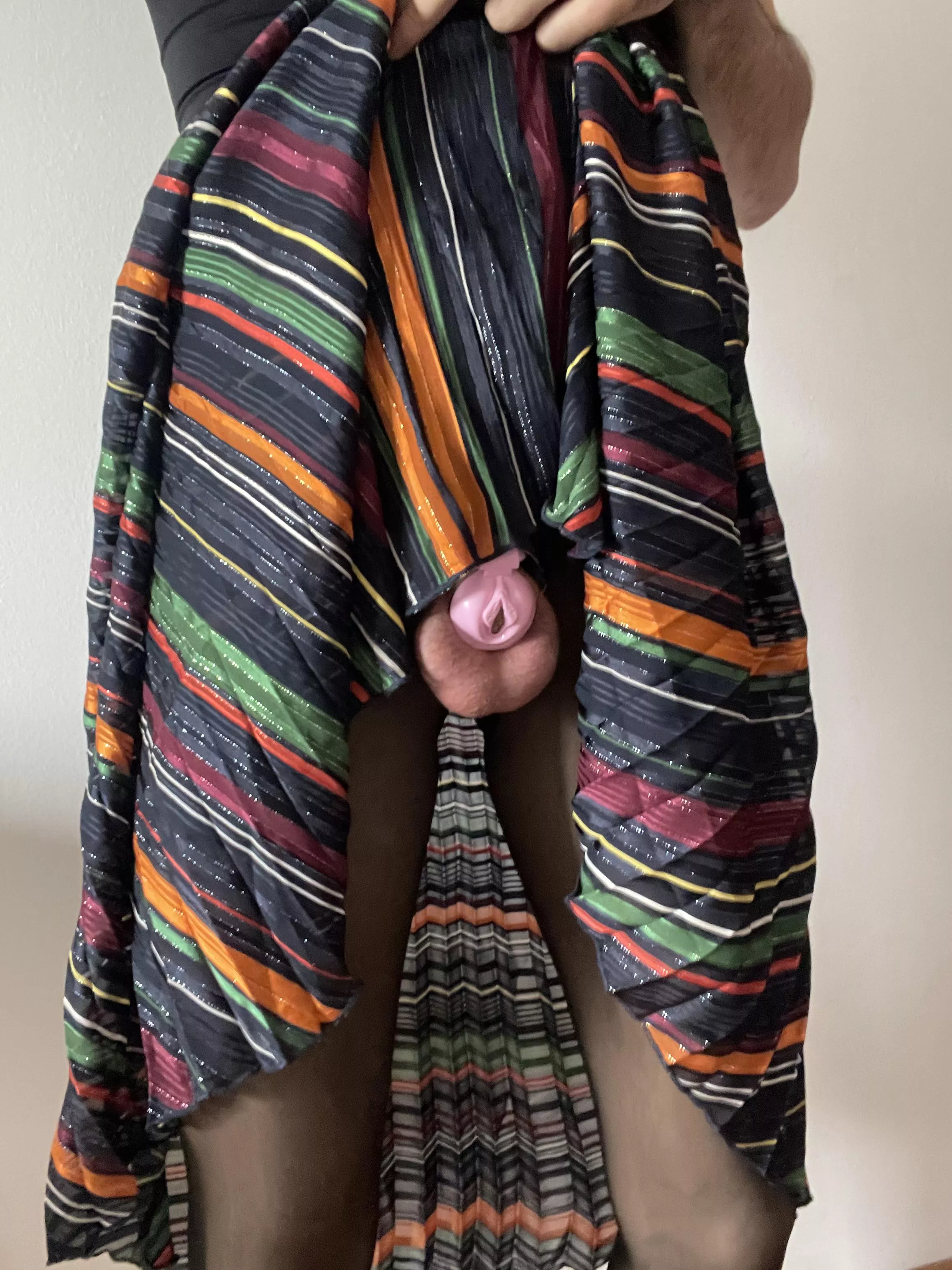 Caged and plugged doing chores like a good housewife