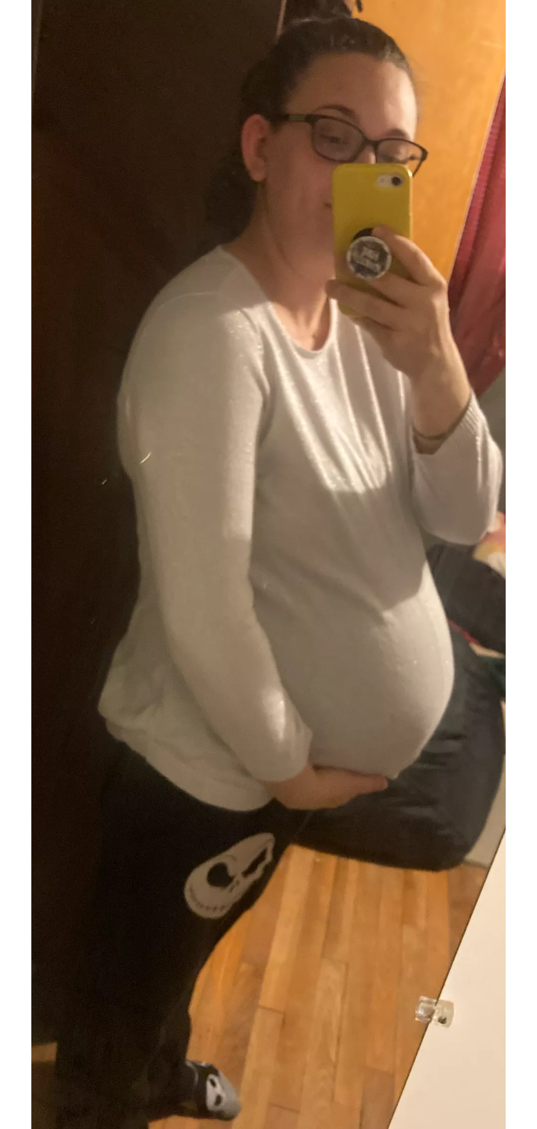 I'm standing behind you waiting to buy groceries. Do you stare, or offer to hold it for me?