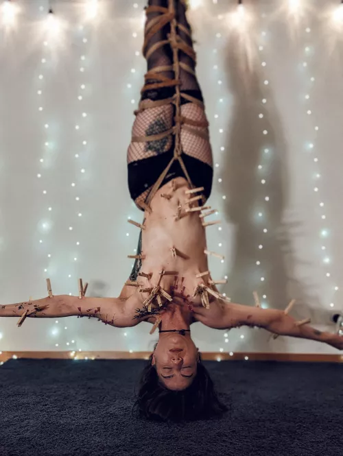 mermaid covered in clothespins and needles