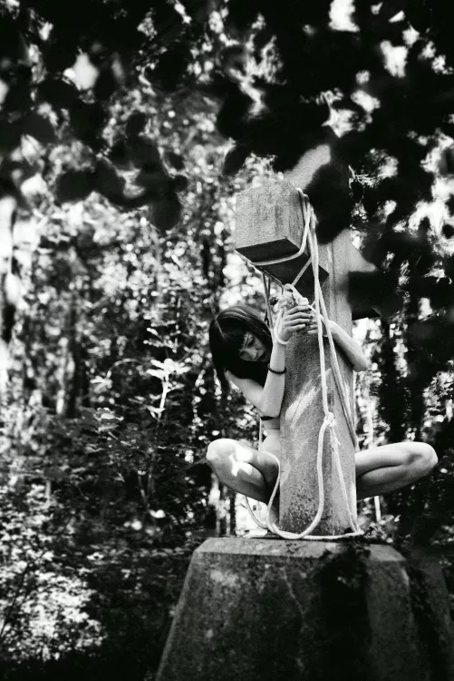 On cross in forest...