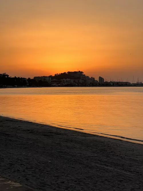 Beach with sunset view of the village castle