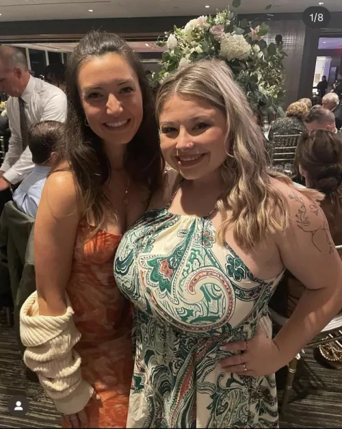 Her tits are so big they’re covering her friend’s