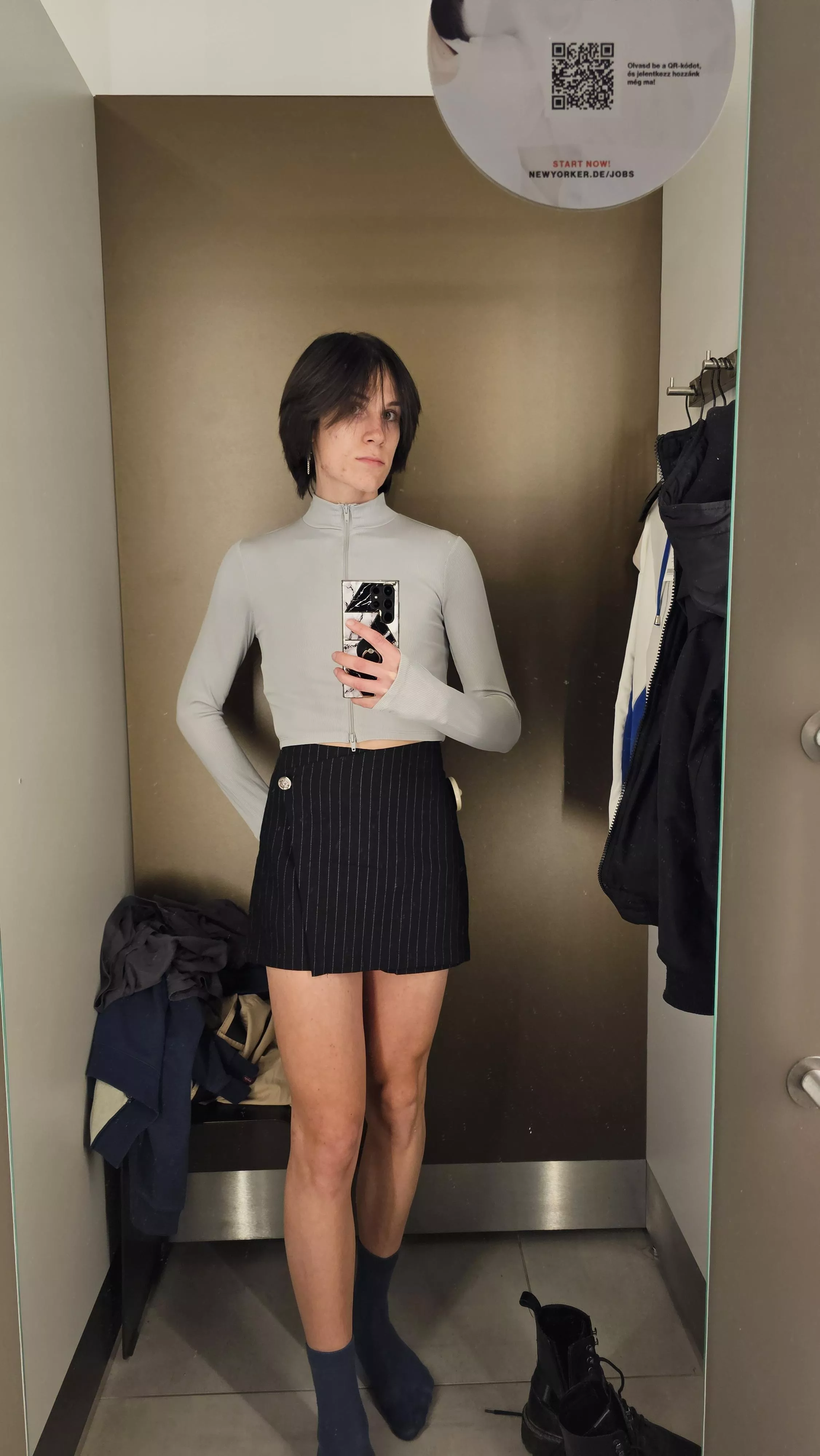 Just a boy trying on a skirt