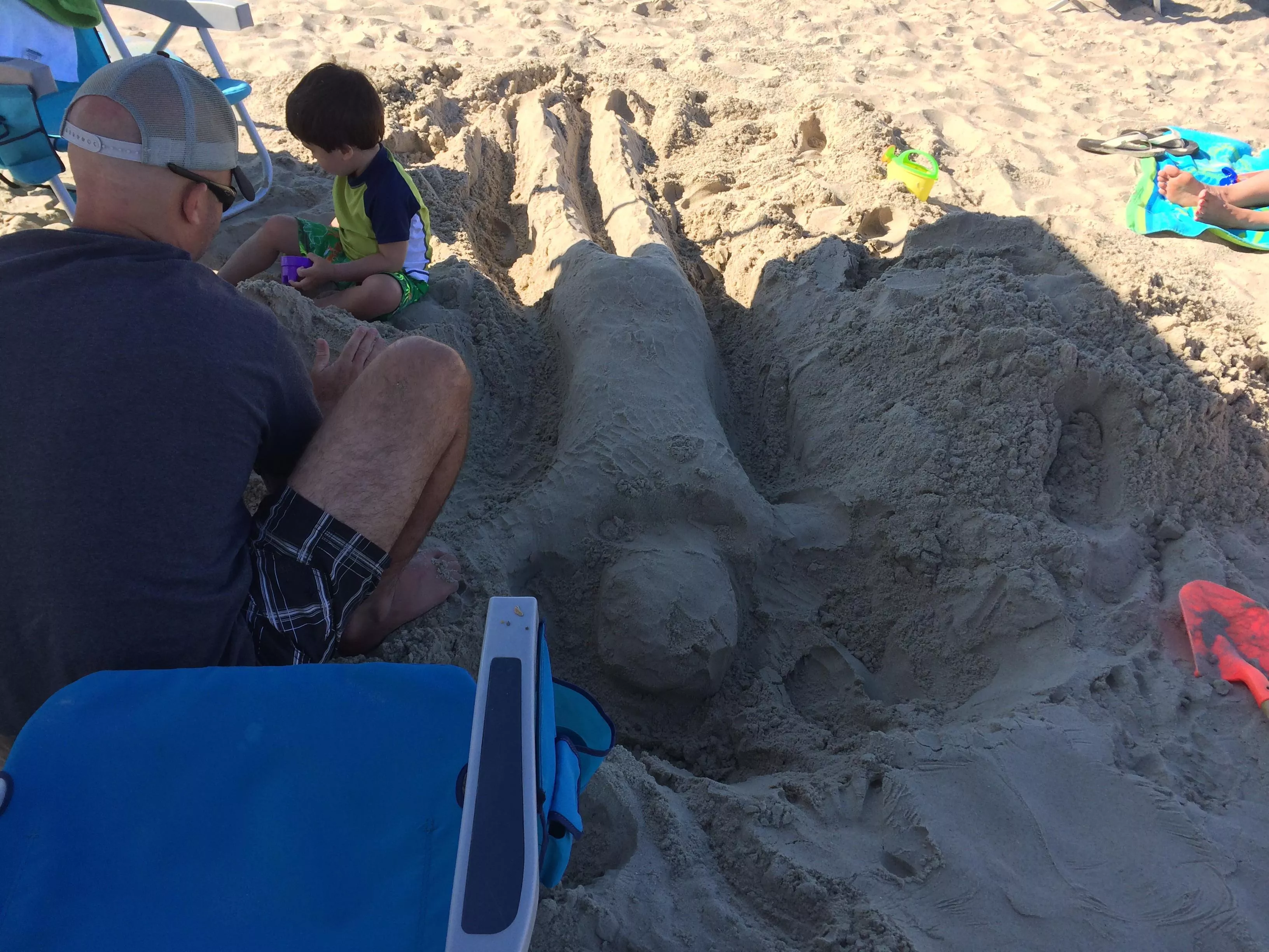 A frustrated parent at the beach. 