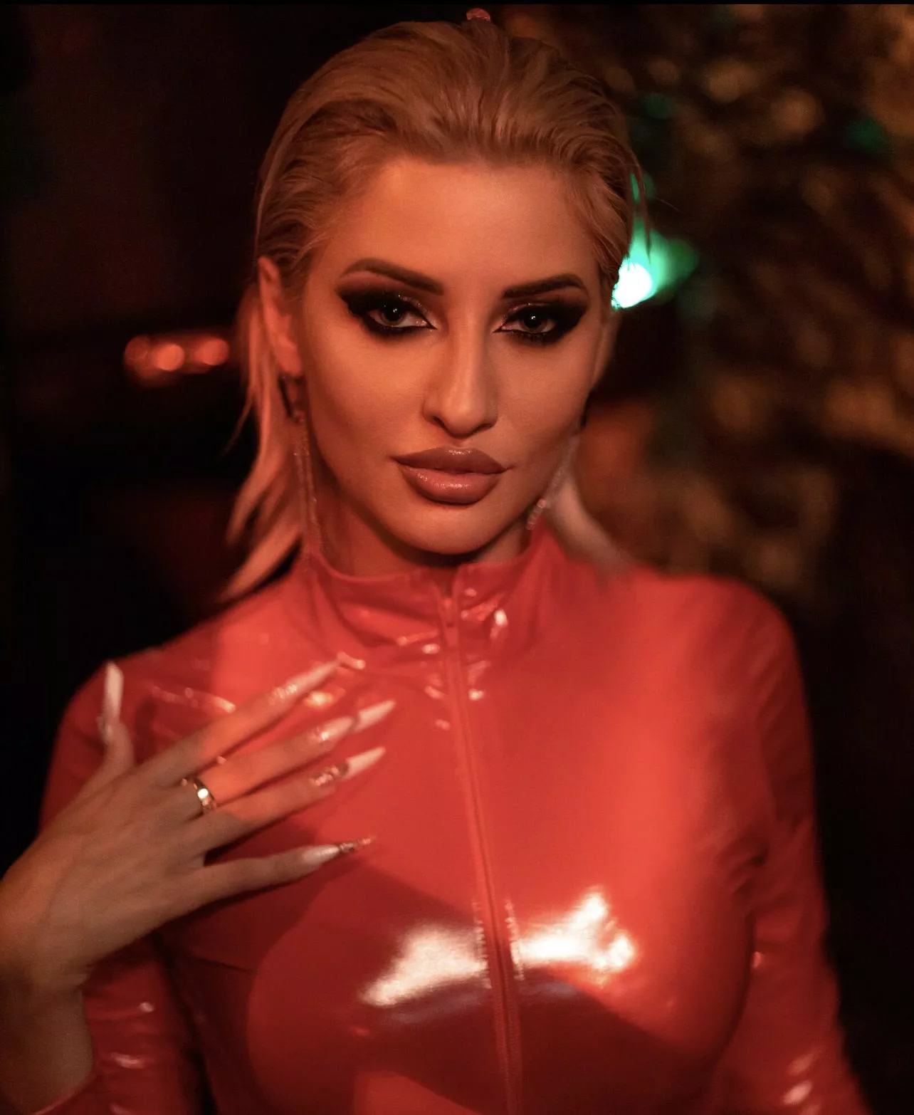 Dressed in red latex to drive you wild