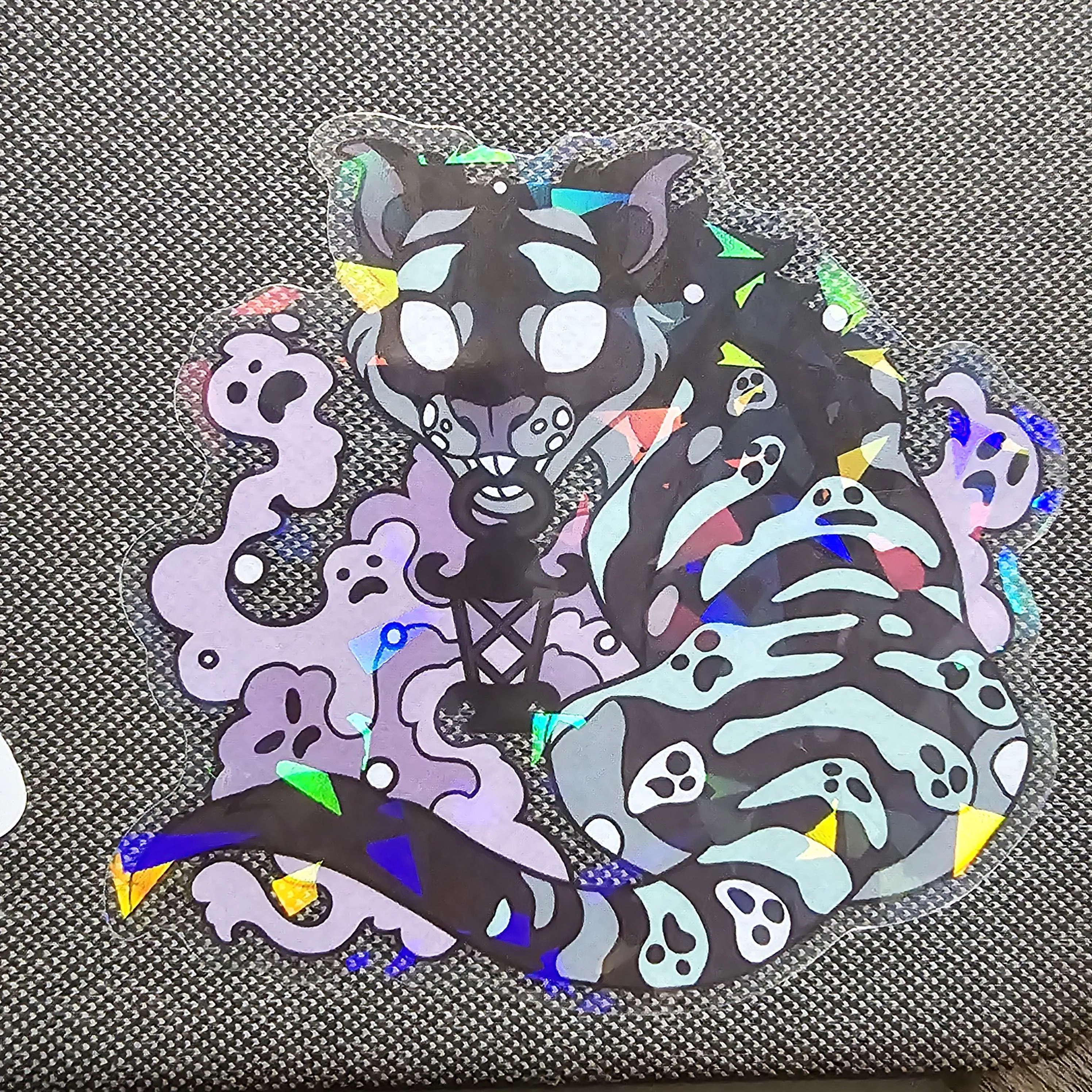 this may be the wrong place for this, but does anyone know the artist of this sticker?