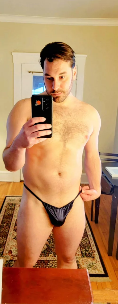Satin midnight blue thong only. How hot it'd be to wear only this while guests are over. 😉😊