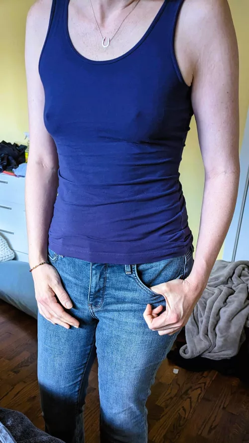 Tight tanktop and jeans with no bra. Just right.