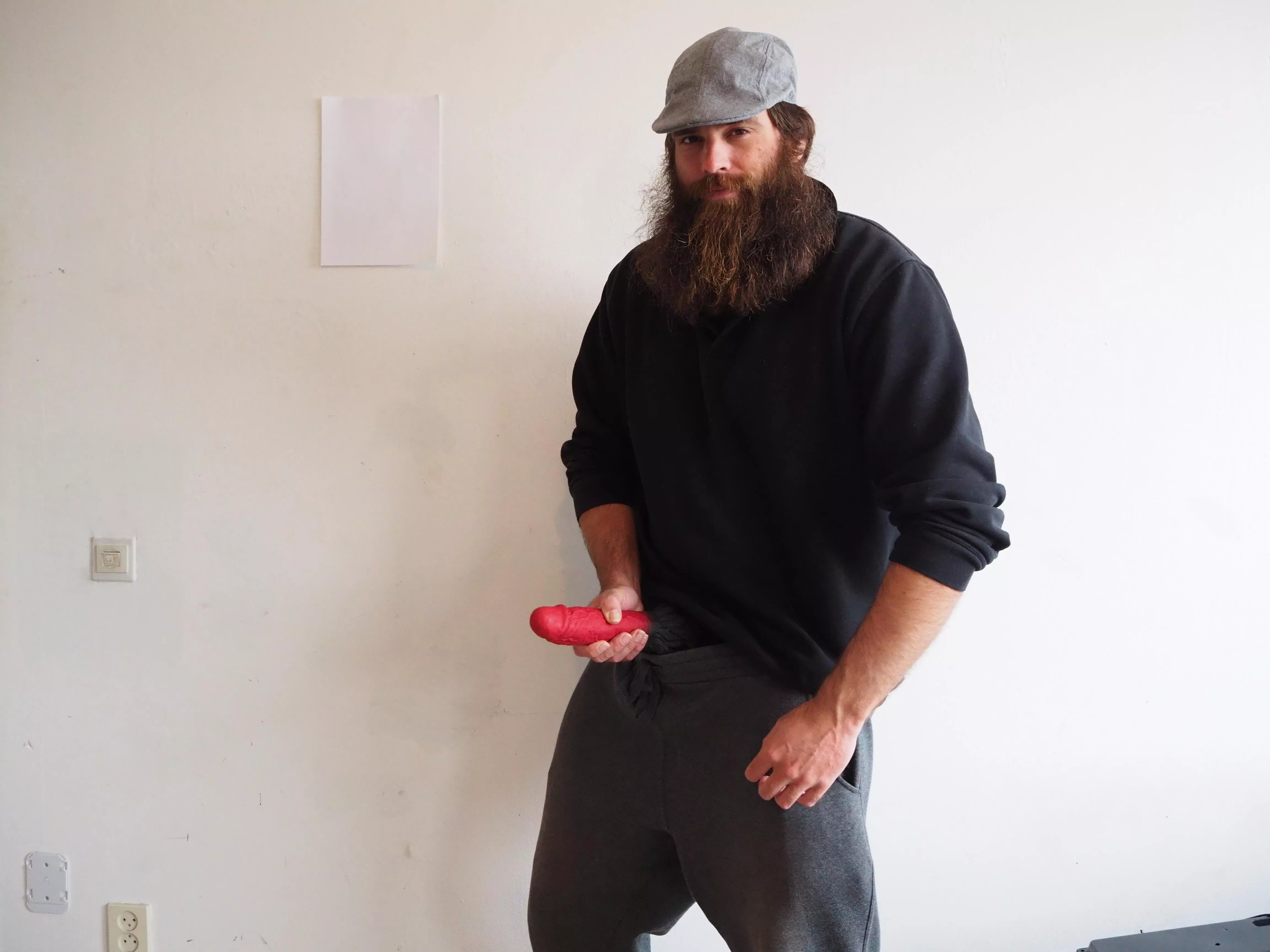 Bearded man with a big dildo