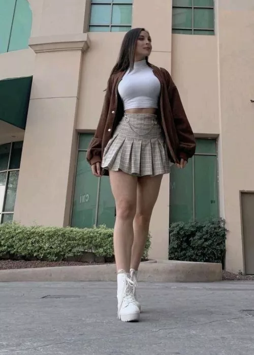 Busty and leggy babe