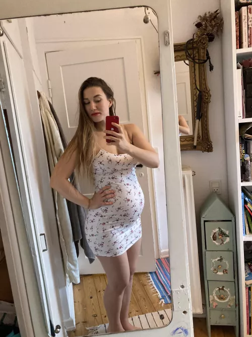 This tight dress shows off my pregnant belly so much