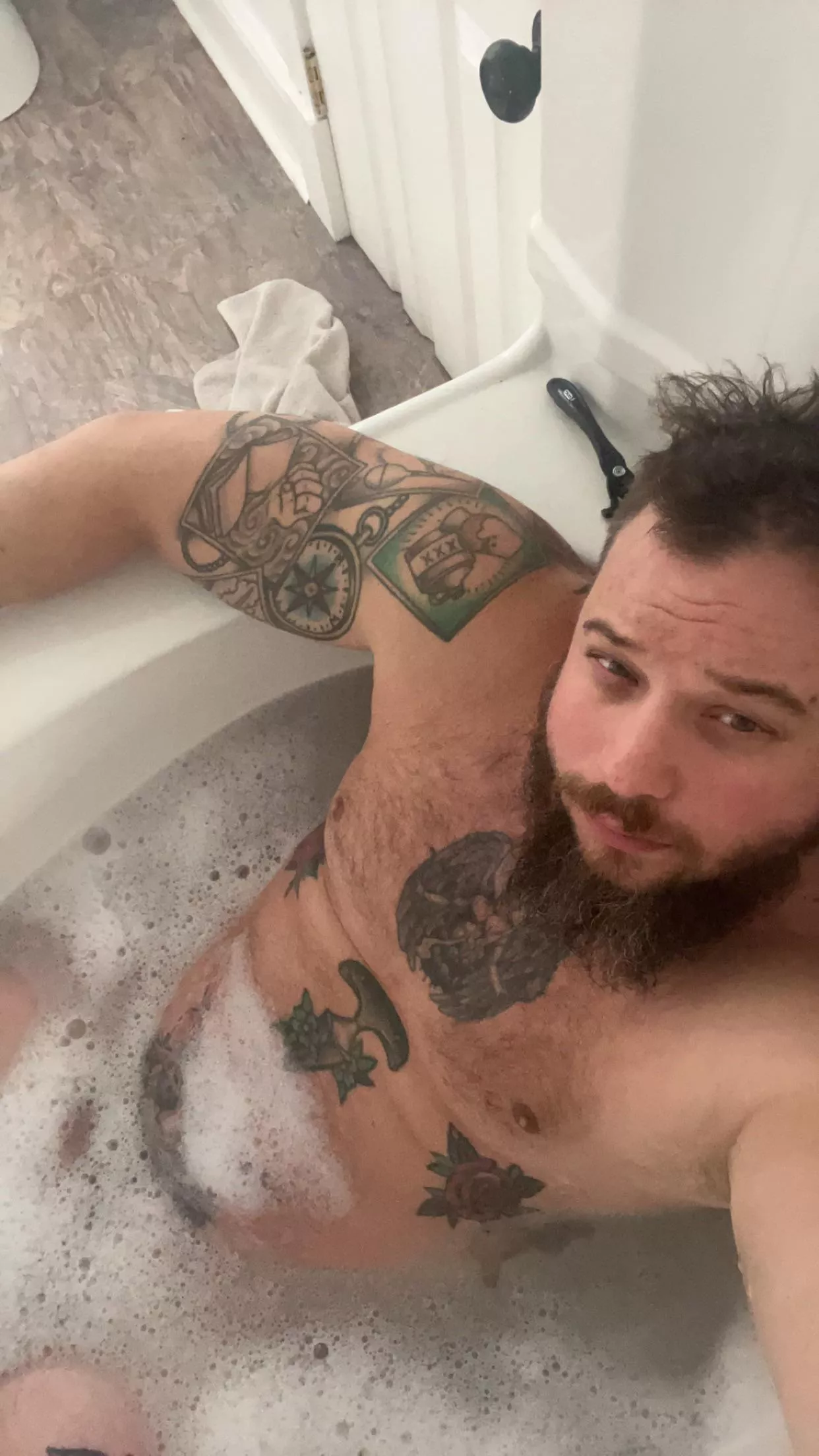 After demo, insulation, drywall, mudding, caulking and painting….I’m having a cocktail in the bath