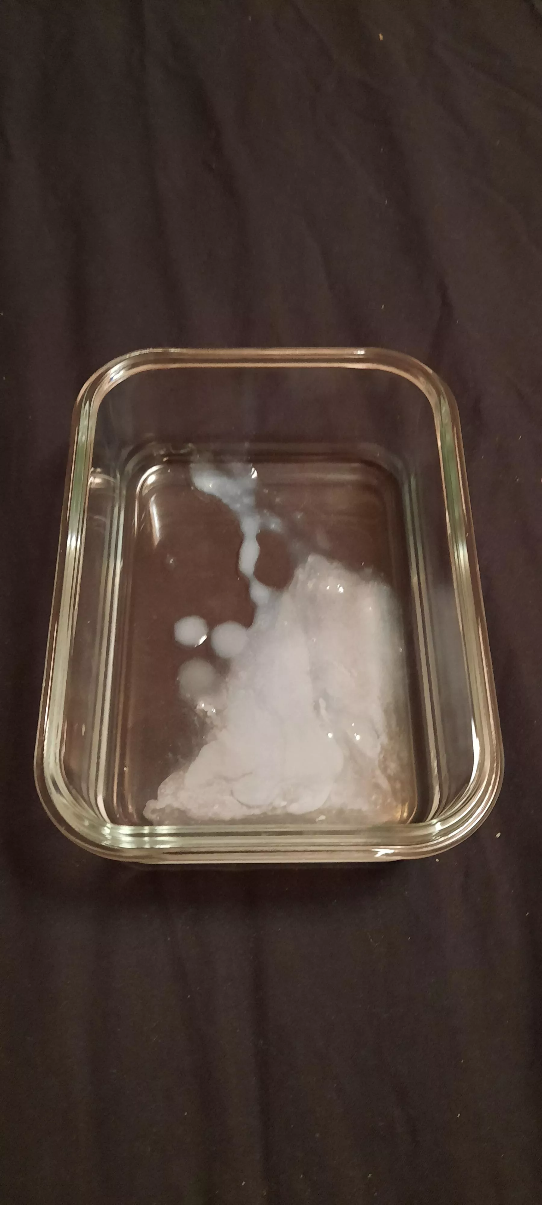 Biggest load I have measured was about 10ml (poured into measuring cup from this tray)