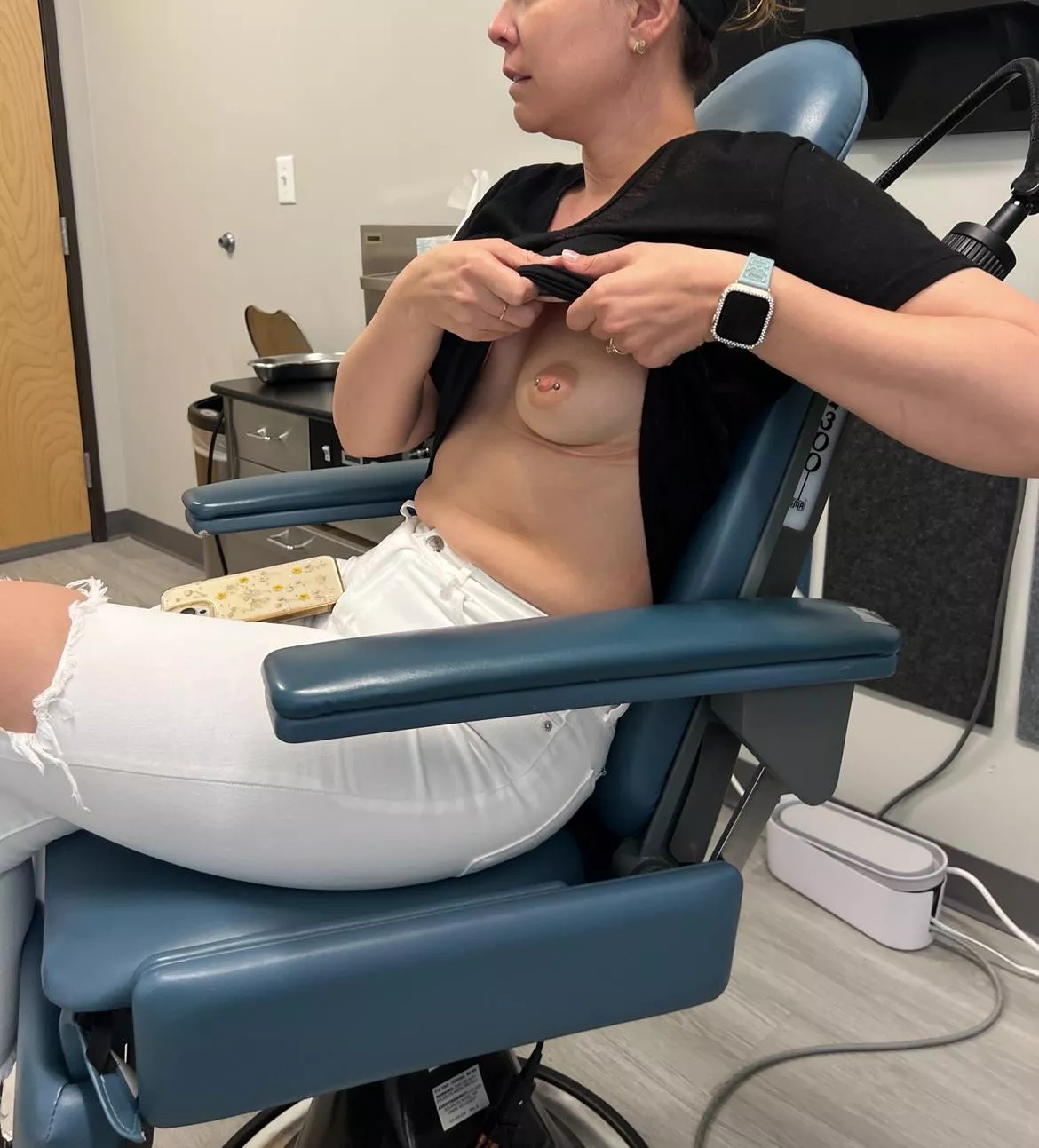 Wife flashing at the doctor. 
