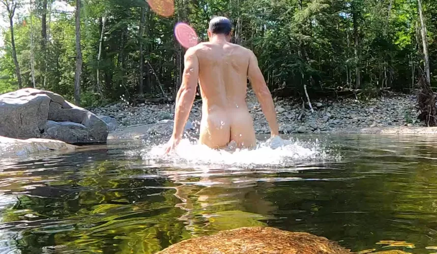 Swimming hole within view of a busy road.