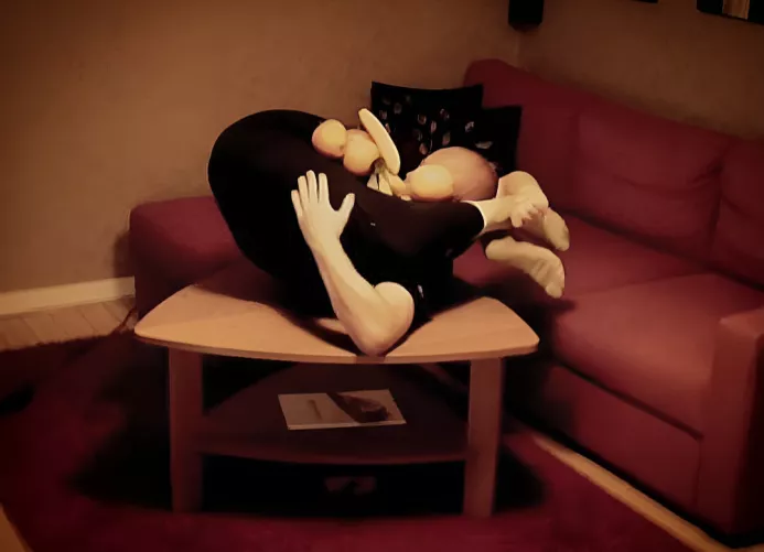 Folded up to a fruit basket on a table.