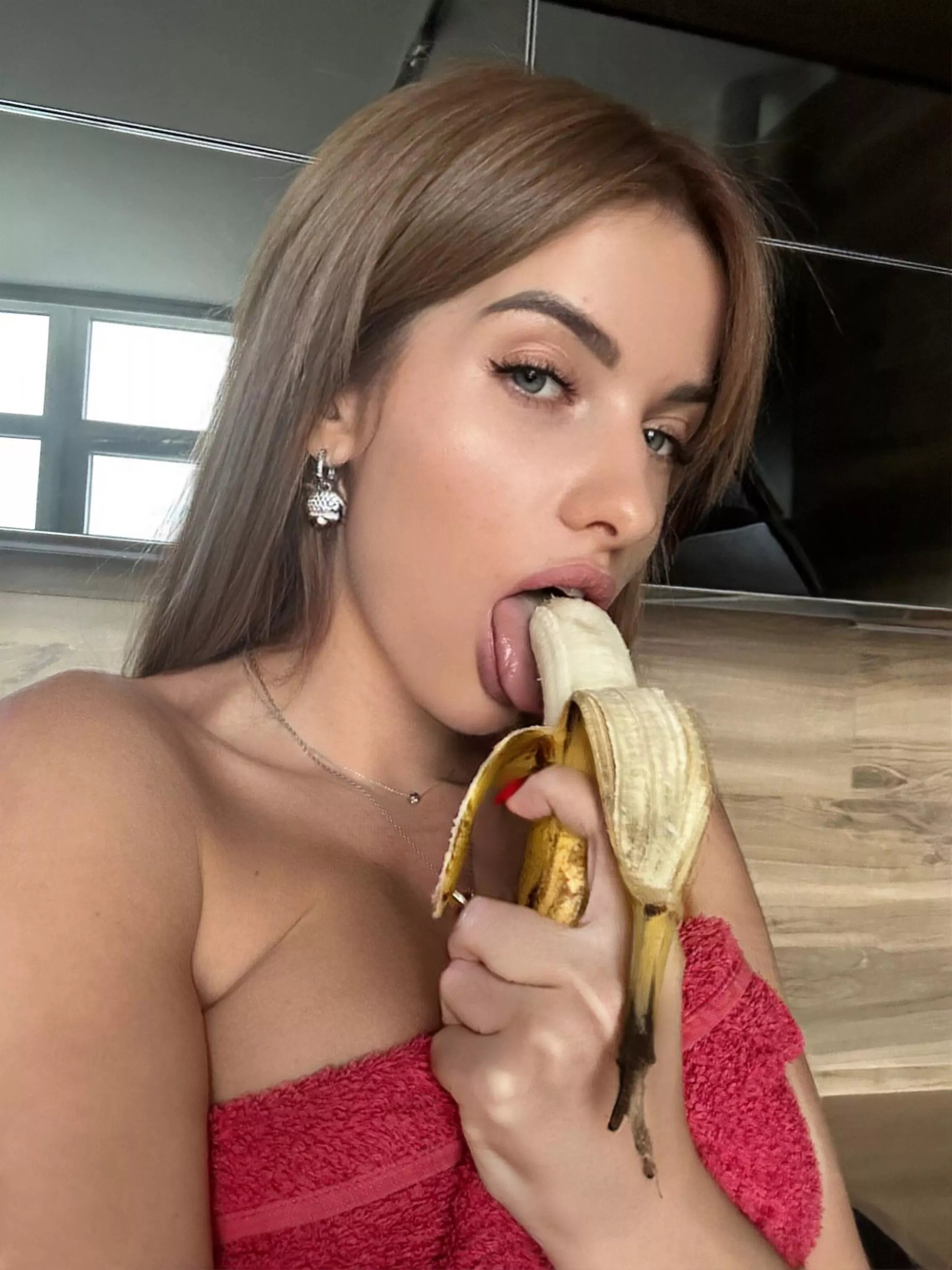 Passionately eating a banana
