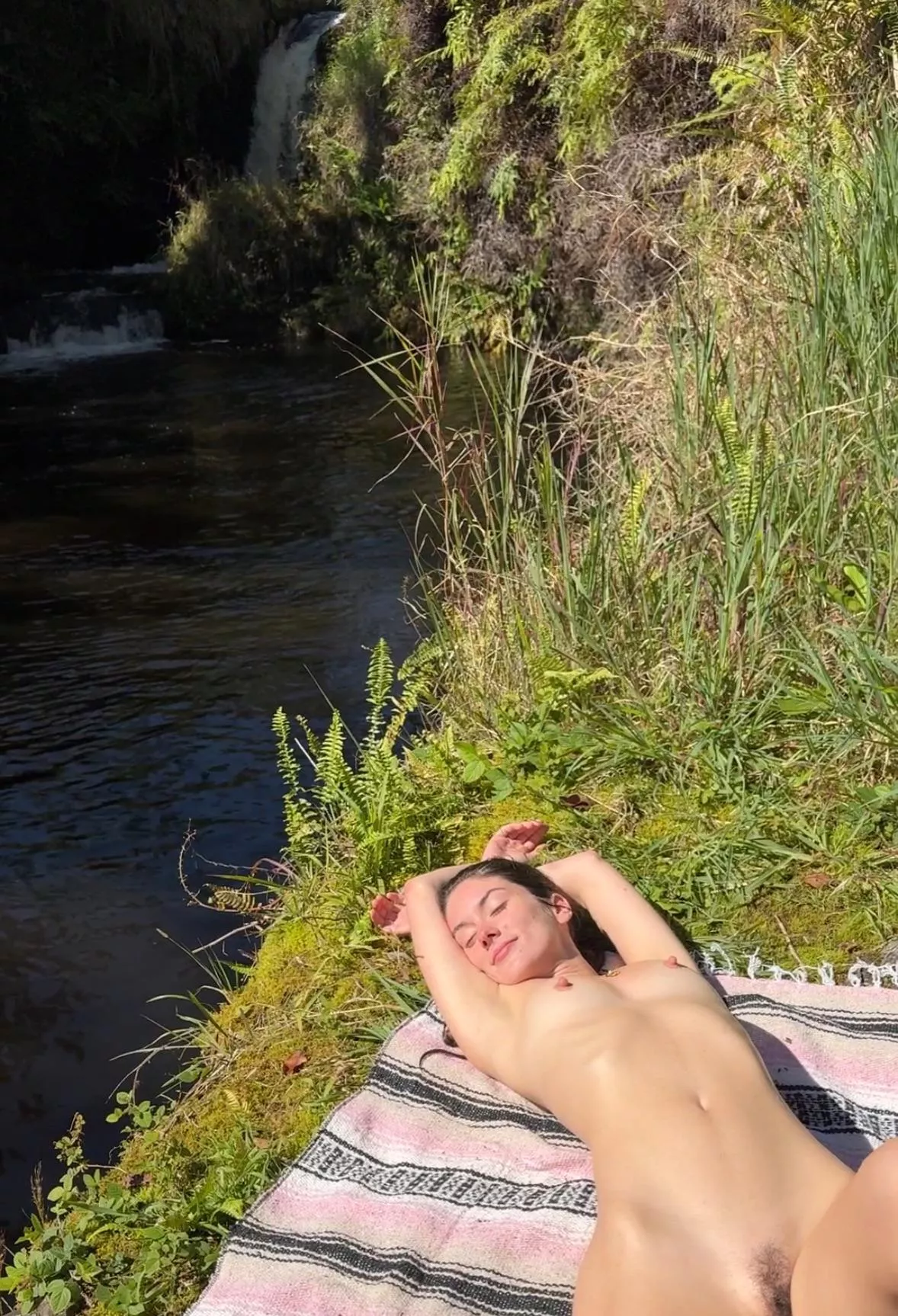 Enjoying the day by a waterfall