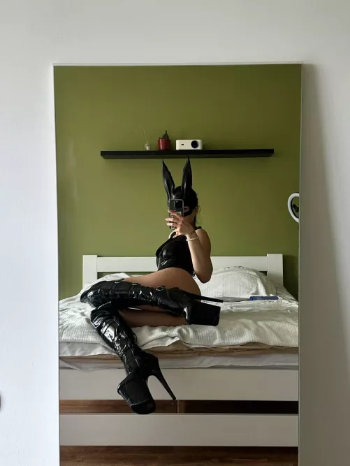 This bunny while chilling on bed is waiting for a carrot!