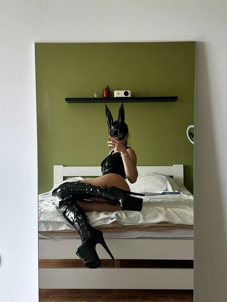 This bunny while chilling on bed is waiting for a carrot!