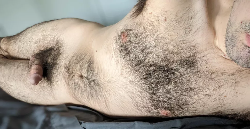 Laying in bed nude with a softy