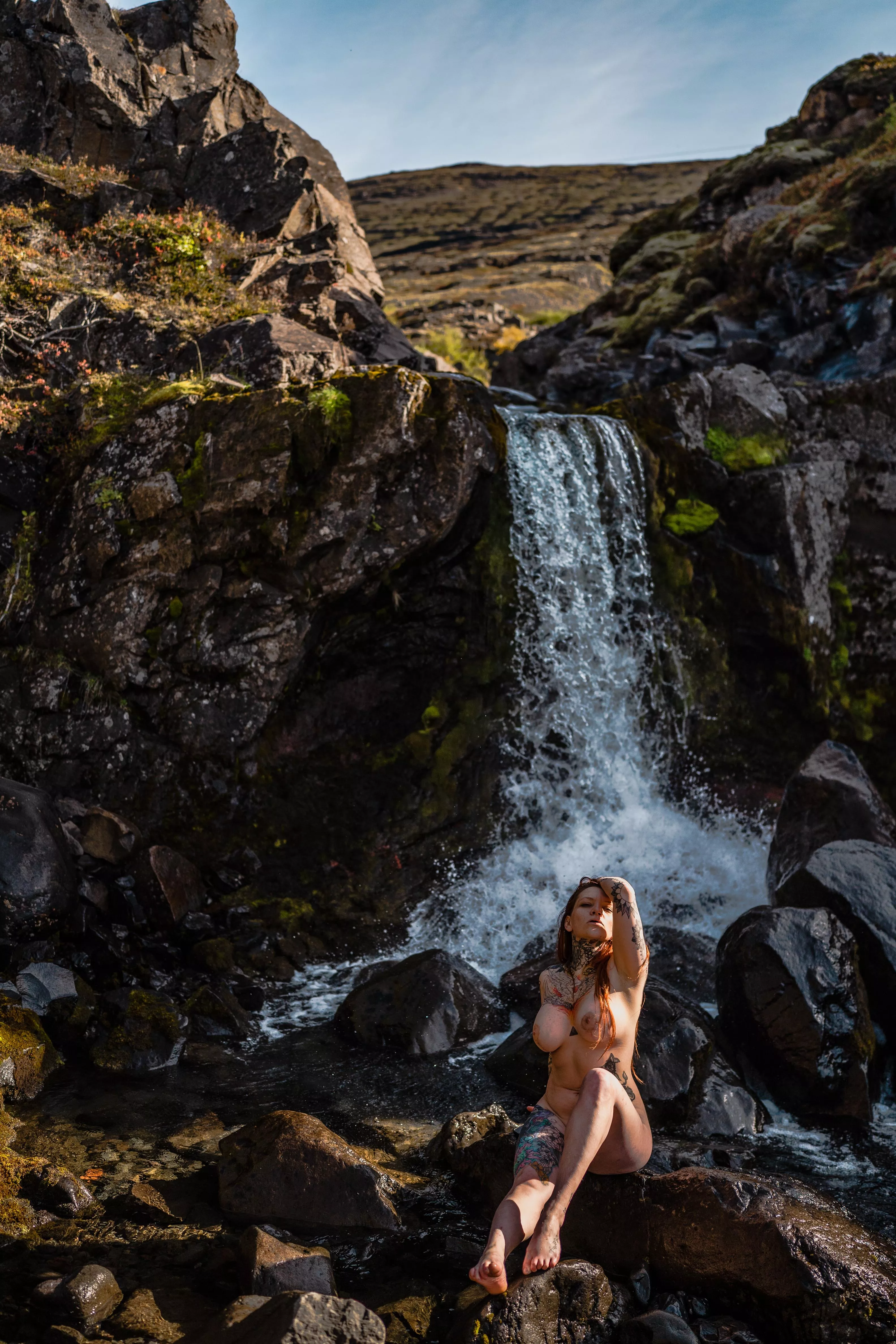 Went to iceland and took some photos by a waterfall.